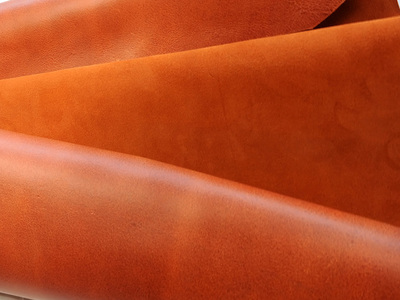 Split leather with a velvety hand and waterproof finishing. Used for handbags and belts and shoes.